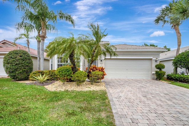 view of front facade featuring a front lawn and a garage