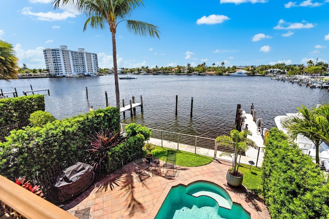 exterior space with a water view and a fenced in pool