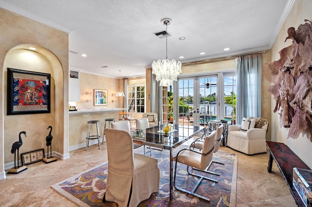 dining area with french doors, crown molding, an inviting chandelier, and light tile floors