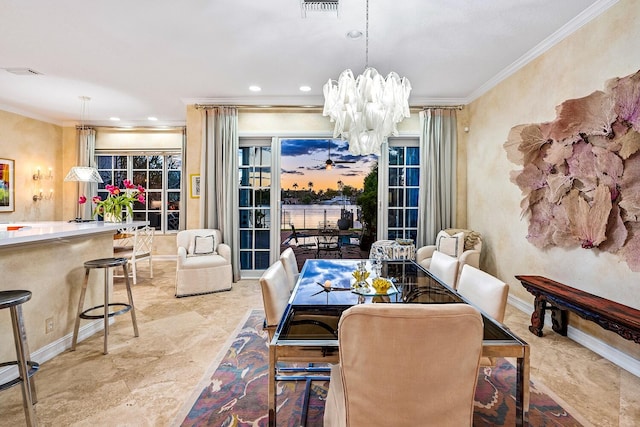 tiled dining area featuring a notable chandelier and crown molding