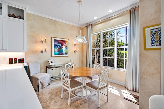 dining room with ornamental molding and light tile floors