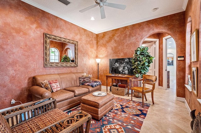 living room featuring ornamental molding, ceiling fan, light tile flooring, and a textured ceiling