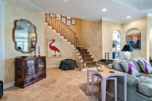 living room with a textured ceiling, crown molding, and light tile floors