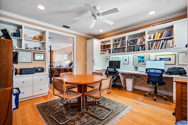 interior space with ornamental molding, a textured ceiling, and light wood-type flooring