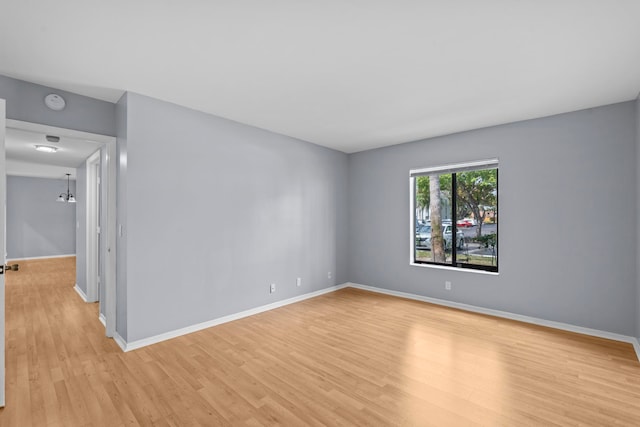 spare room with light hardwood / wood-style floors