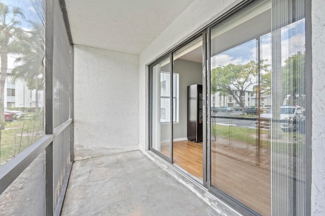 unfurnished sunroom with plenty of natural light