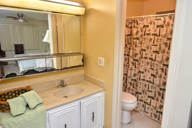 bathroom with vanity, ceiling fan, tile patterned flooring, and toilet