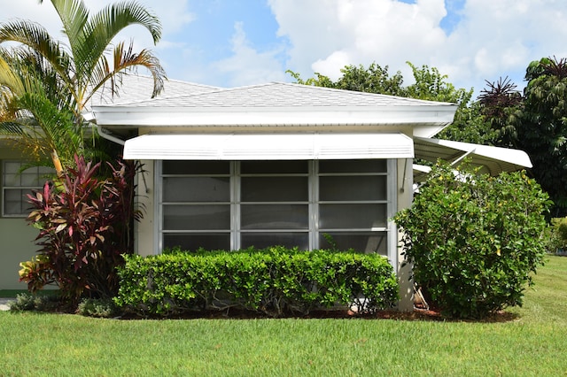 view of home's exterior featuring a yard