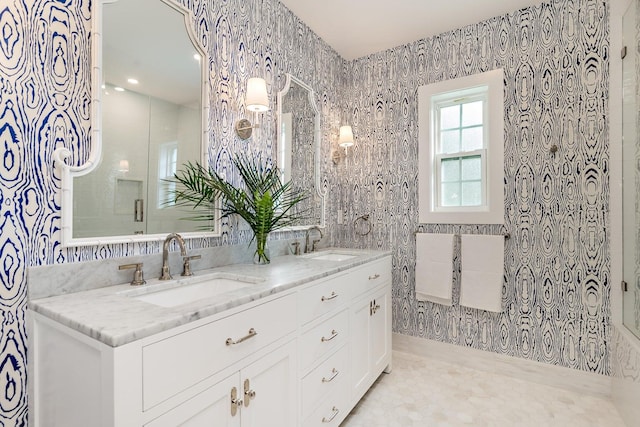 bathroom featuring dual sinks, oversized vanity, and tile floors