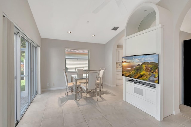 dining space featuring ceiling fan, light tile patterned floors, and a healthy amount of sunlight