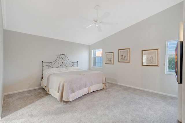 bedroom featuring ceiling fan, light carpet, and vaulted ceiling