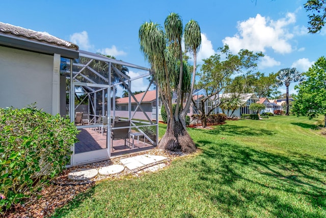 view of yard with a lanai