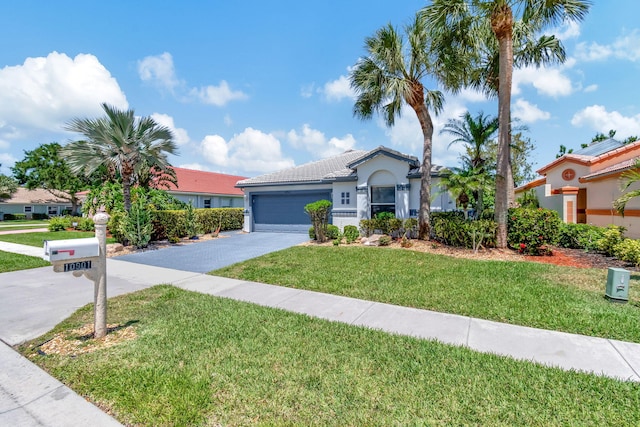 view of front facade featuring a garage and a front lawn