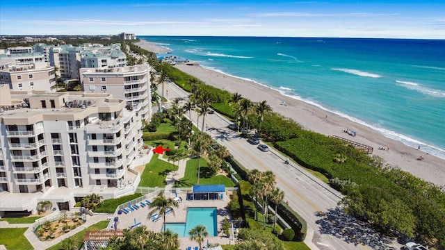 bird's eye view with a beach view and a water view