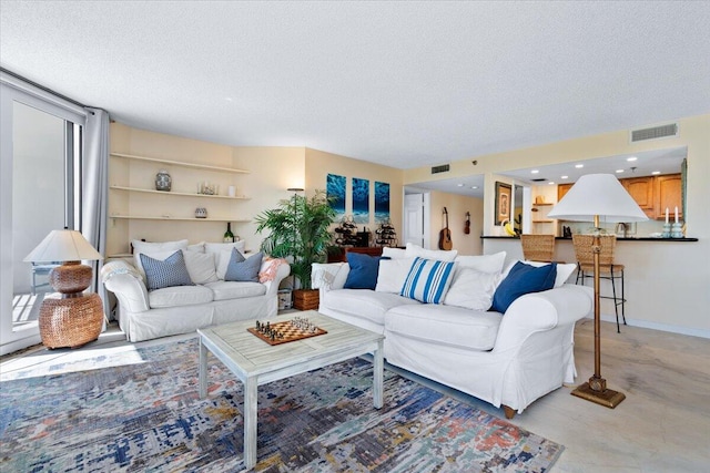 living room with a textured ceiling