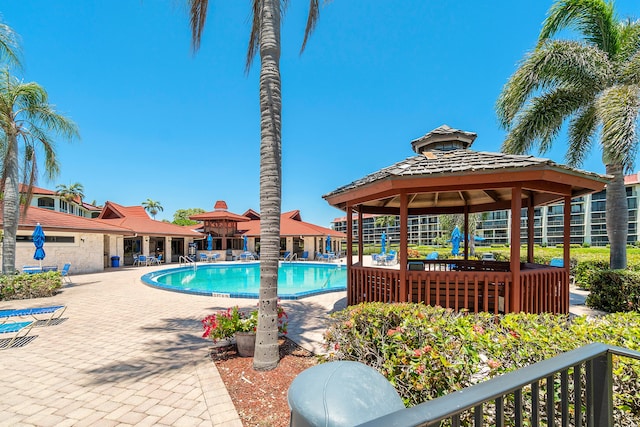 view of swimming pool featuring a patio area and a gazebo