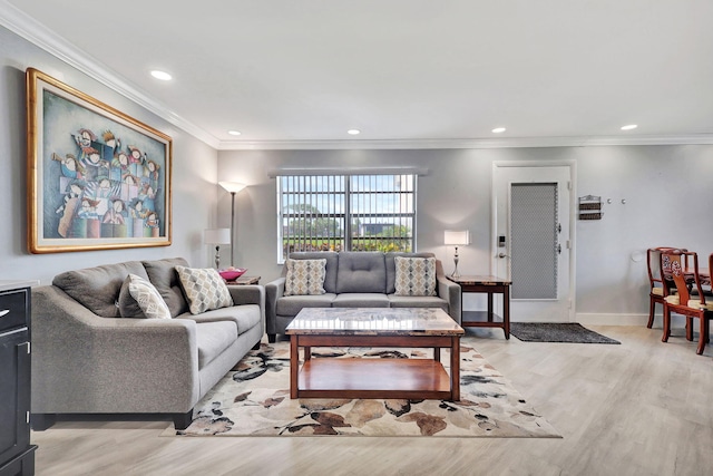 living area with light wood-type flooring, crown molding, baseboards, and recessed lighting