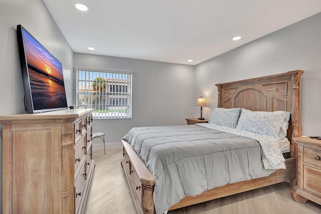 bedroom with light wood-style floors, recessed lighting, and baseboards