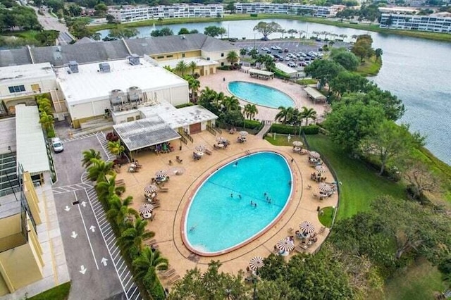 birds eye view of property with a water view