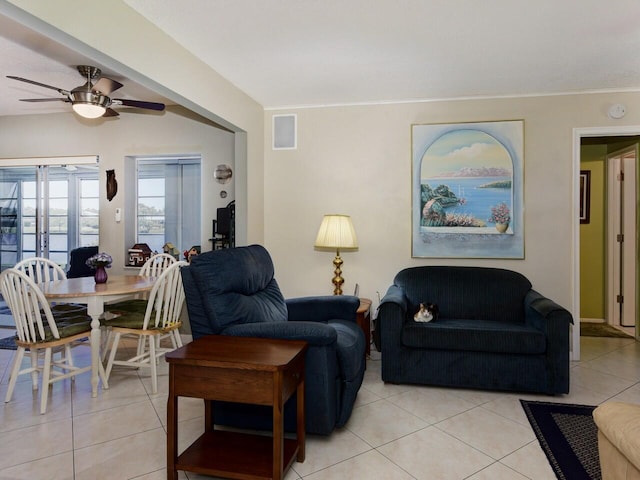 living room featuring ceiling fan and light tile floors