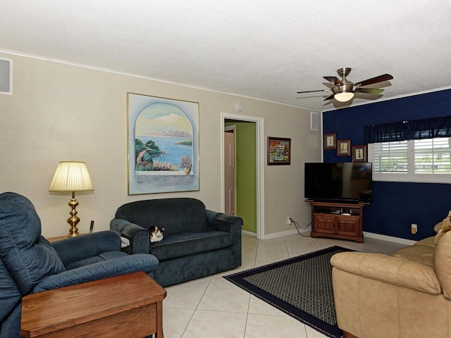 tiled living room featuring ceiling fan and a textured ceiling