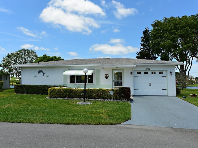 single story home with a garage and a front lawn