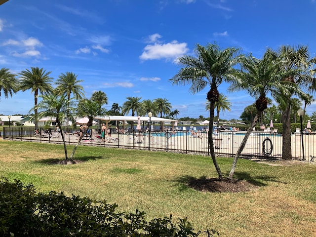 view of yard featuring a community pool