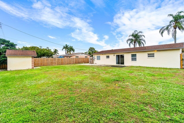 view of yard with a storage unit