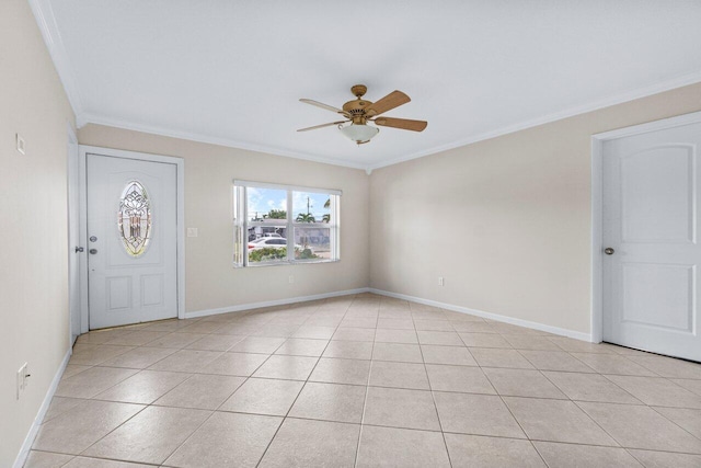 tiled foyer entrance featuring ornamental molding and ceiling fan