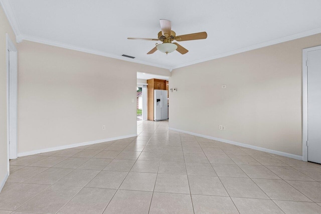 tiled spare room featuring crown molding and ceiling fan