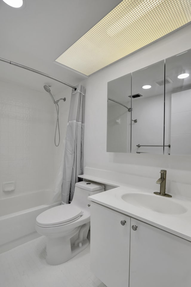 full bathroom with tile floors, toilet, shower / bath combo, and vanity