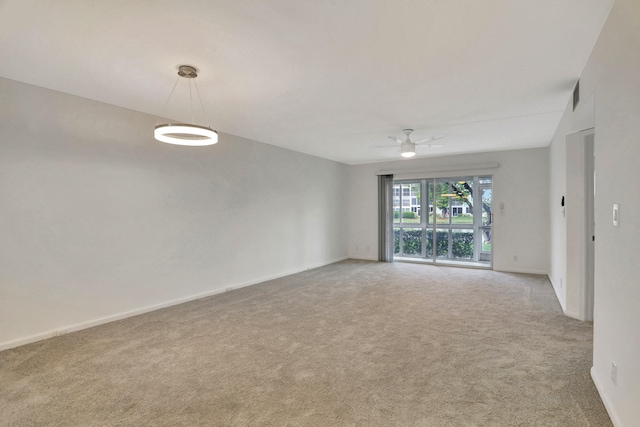 carpeted empty room with ceiling fan