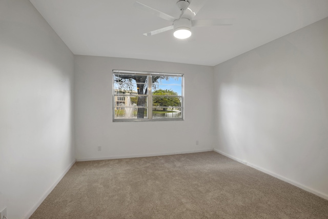 empty room with light carpet and ceiling fan