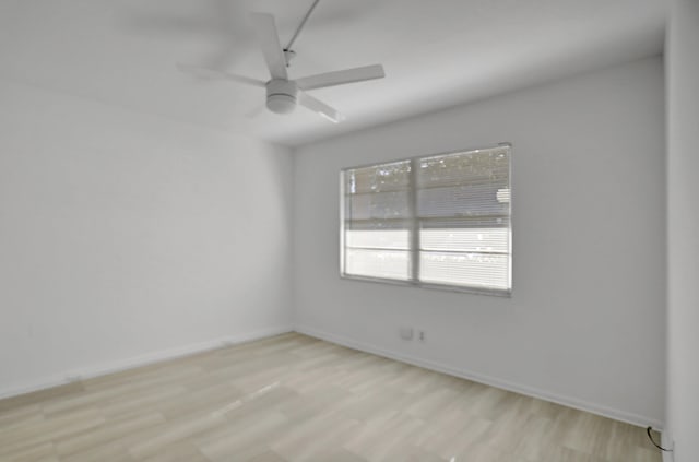 empty room featuring ceiling fan and light wood-type flooring