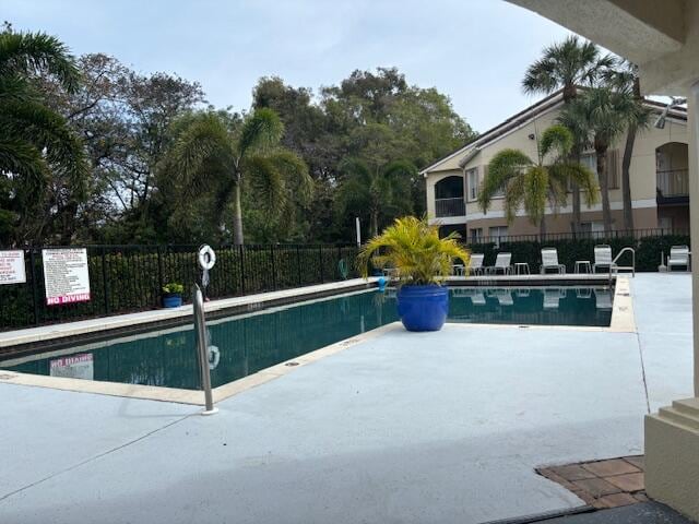 view of swimming pool featuring a patio area