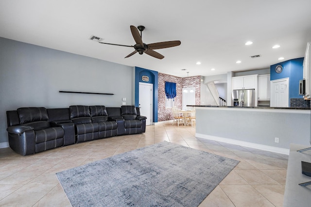 tiled living room featuring ceiling fan