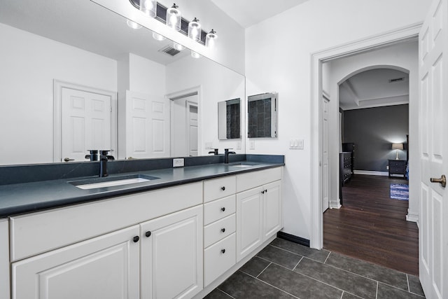 bathroom featuring vanity and hardwood / wood-style floors