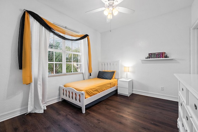 bedroom featuring dark hardwood / wood-style flooring and ceiling fan