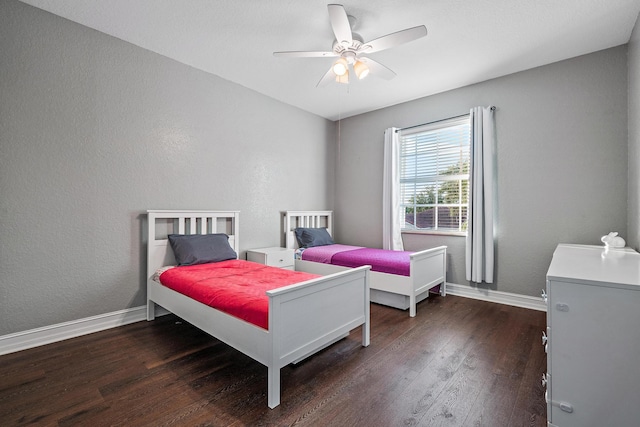 bedroom featuring ceiling fan and dark hardwood / wood-style flooring