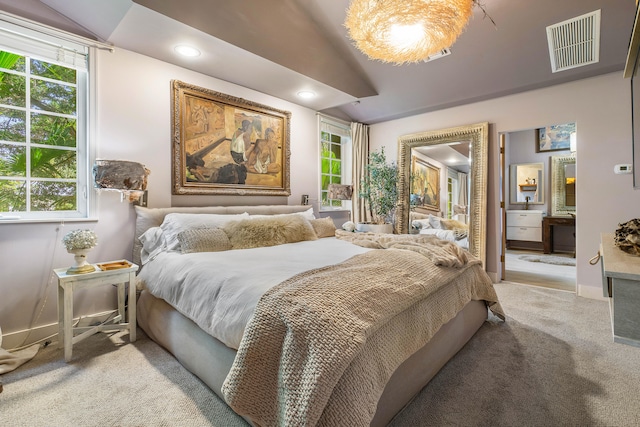 carpeted bedroom with vaulted ceiling