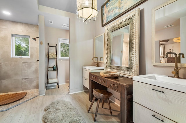 bathroom featuring dual bowl vanity