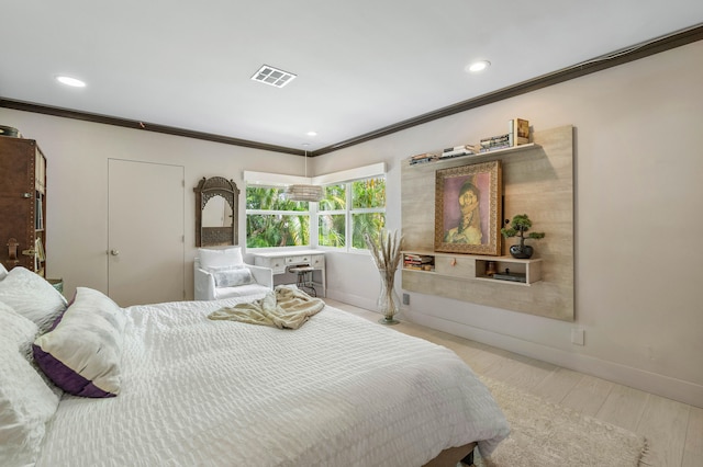 bedroom featuring crown molding and light wood-type flooring