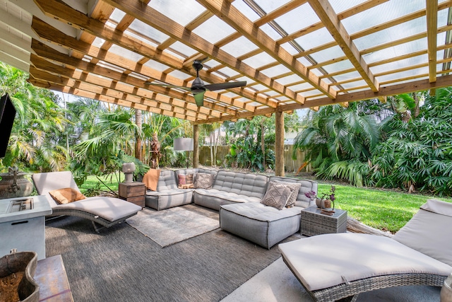 view of patio / terrace featuring outdoor lounge area, a pergola, and ceiling fan