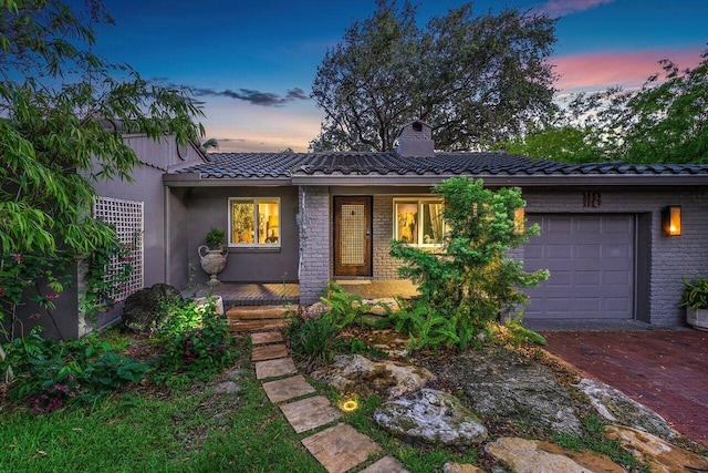 view of front of property featuring a garage