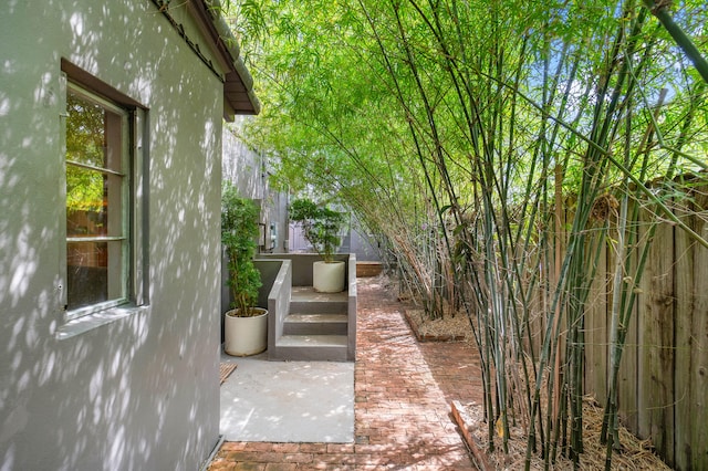 view of side of home with a patio