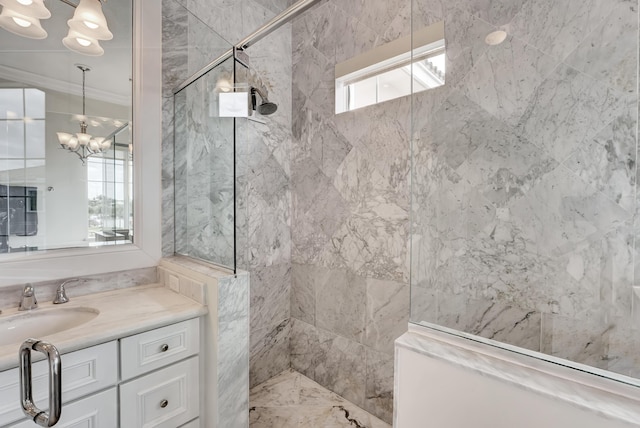 bathroom with a tile shower, a wealth of natural light, vanity, and ornamental molding