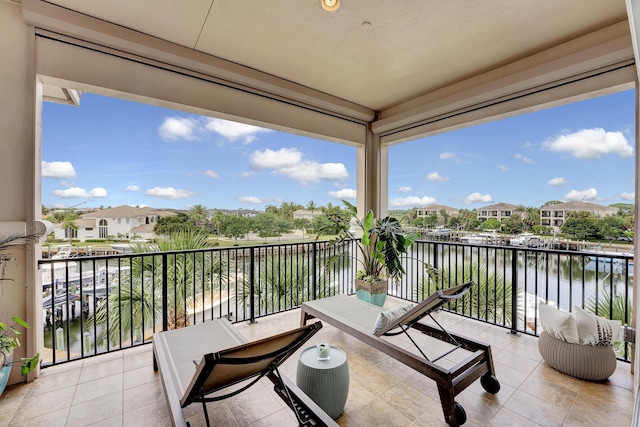 balcony featuring a water view