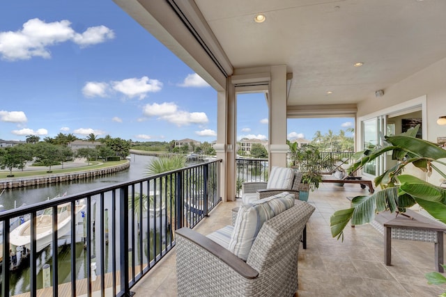 balcony featuring a water view