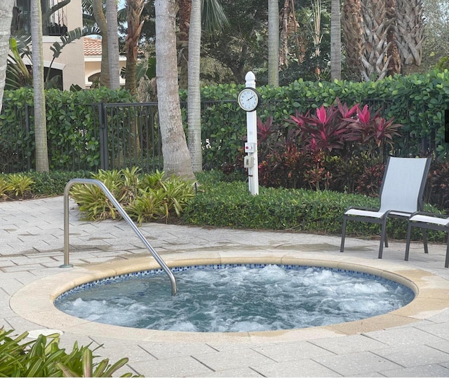 view of pool with a community hot tub