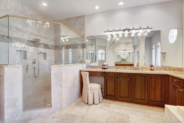 bathroom featuring an enclosed shower and vanity